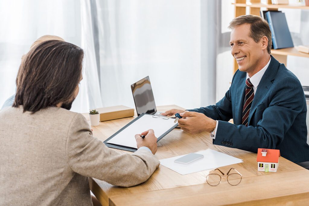 Banker-reviews-loan-terms-with-couple